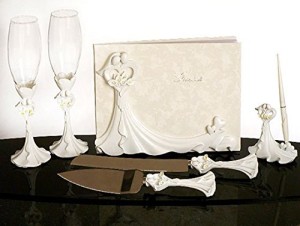 Ivory wedding guest book and pen set with cake cutter and flutes